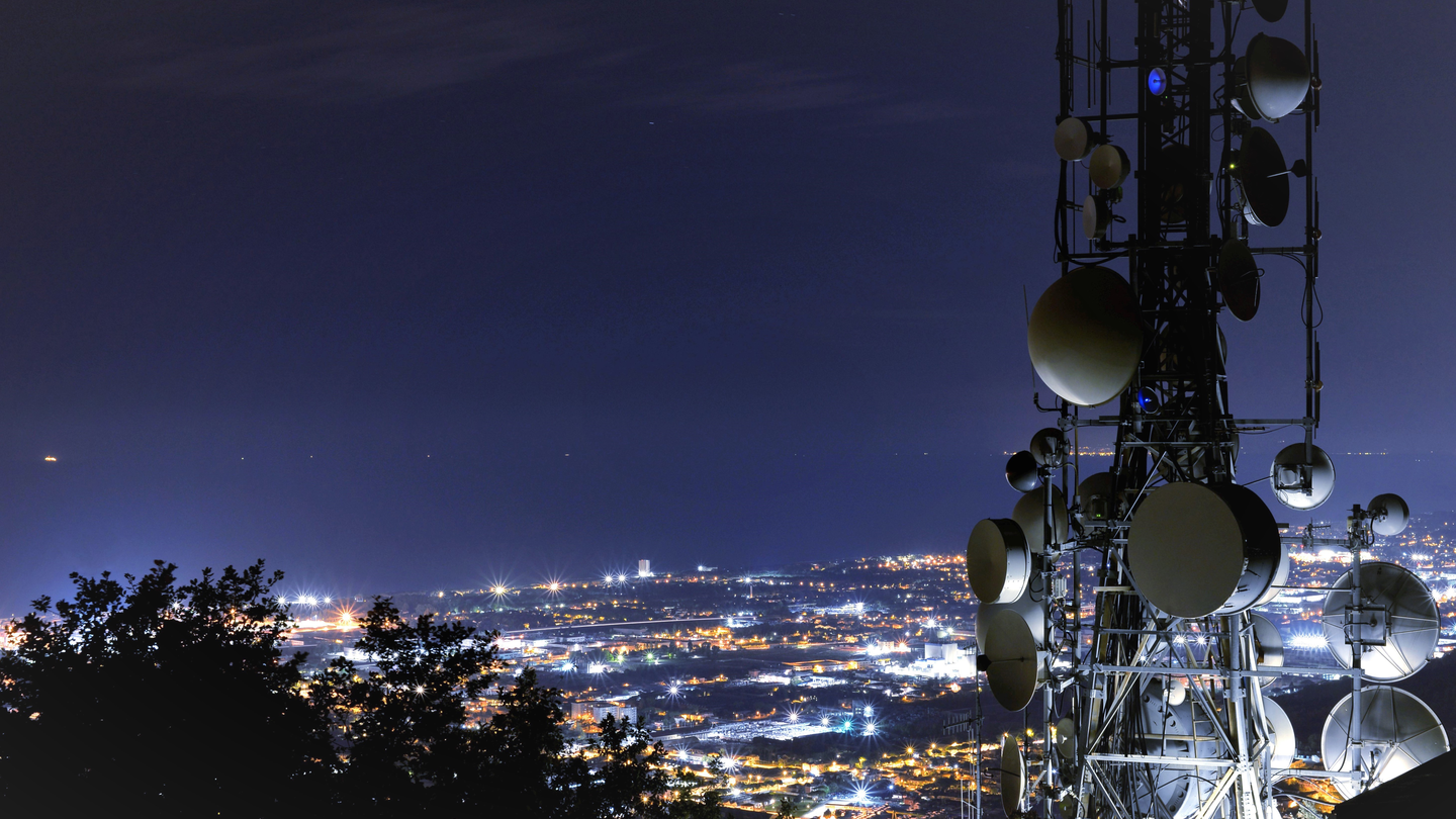 Cell tower with phone in hand