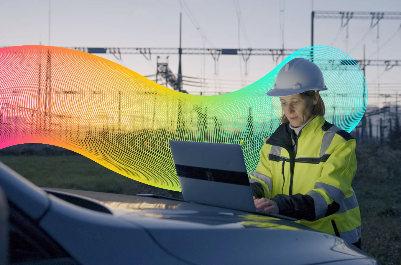 Stylised banner of Vocus worker in hardhat looking at laptop outside power station