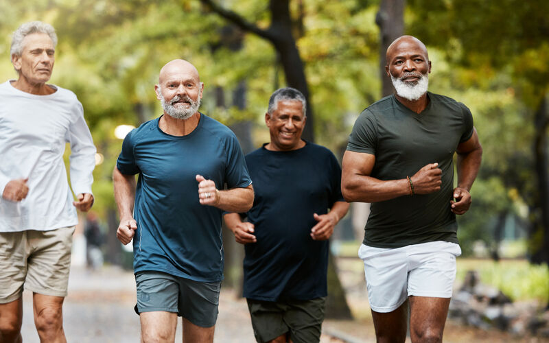 a group of men running int he park