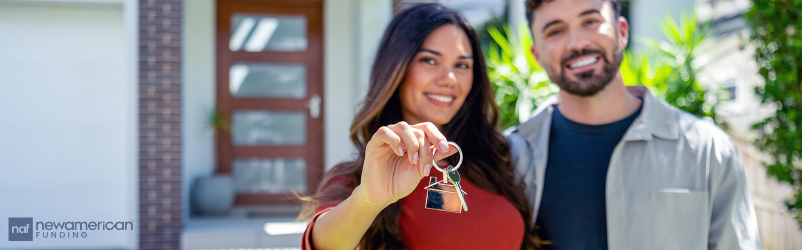 couple showing off new house keys