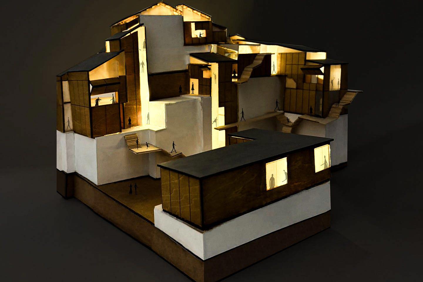 Photograph of Daisy Chen’s elaborate 3D Blockology model titled Shadow Puppet House, captured in the dark and illuminated from within to highlight its internal structure and layered details.