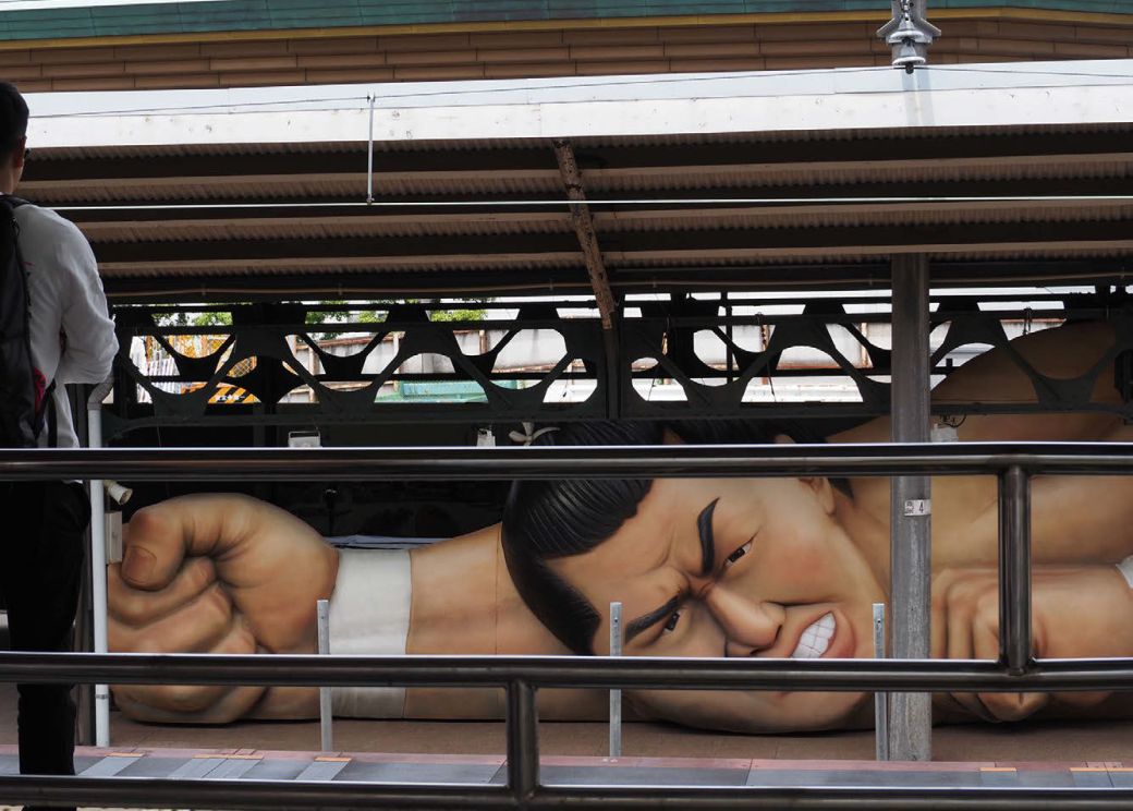 A giant sumo wrestler appears on the JR Ryogoku Station platform