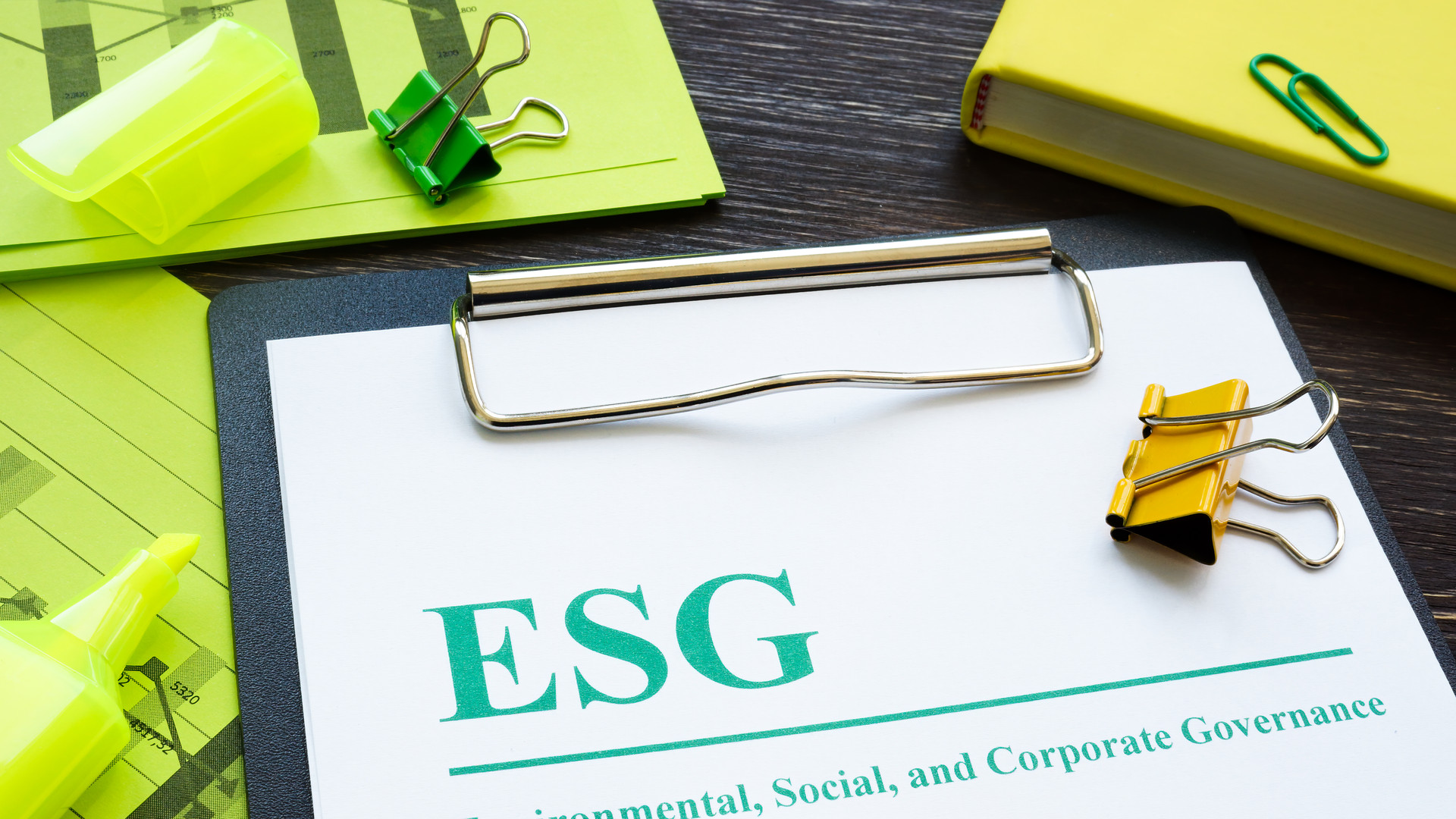 Papers about ESG Environmental, Social and Corporate Governance and notepad.