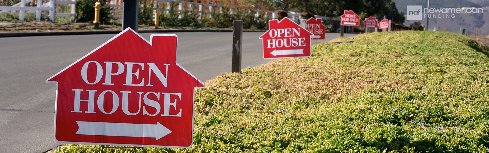 open house signs lined up in the streets