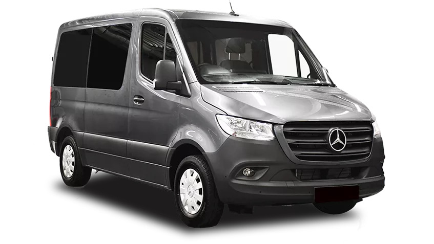 Front-side view of a dark grey Mercedes-Benz Sprinter van, known for its high roofline and spacious interior, often used for accessible conversions or group travel.