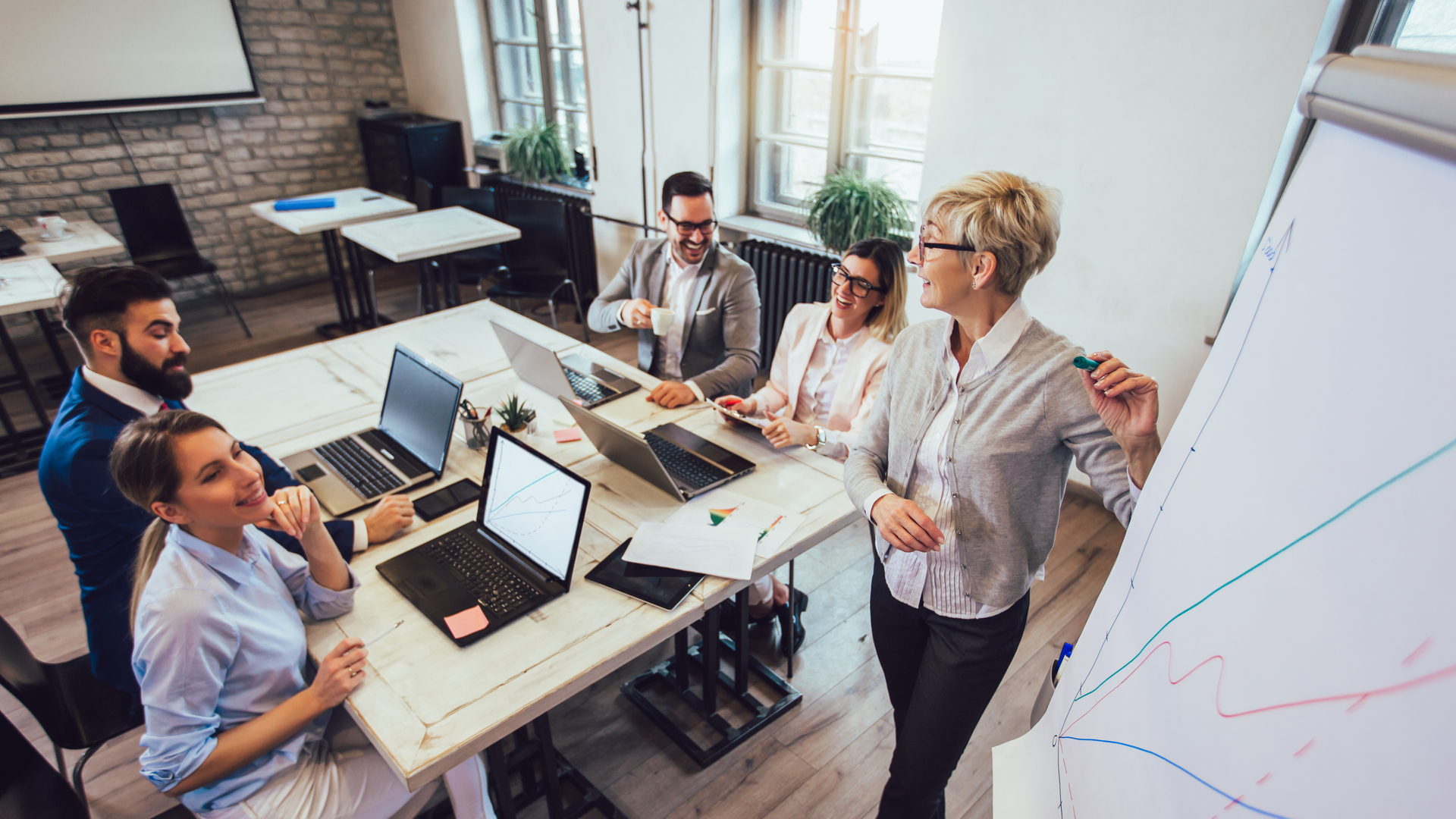 Business colleagues in conference meeting room during presentation