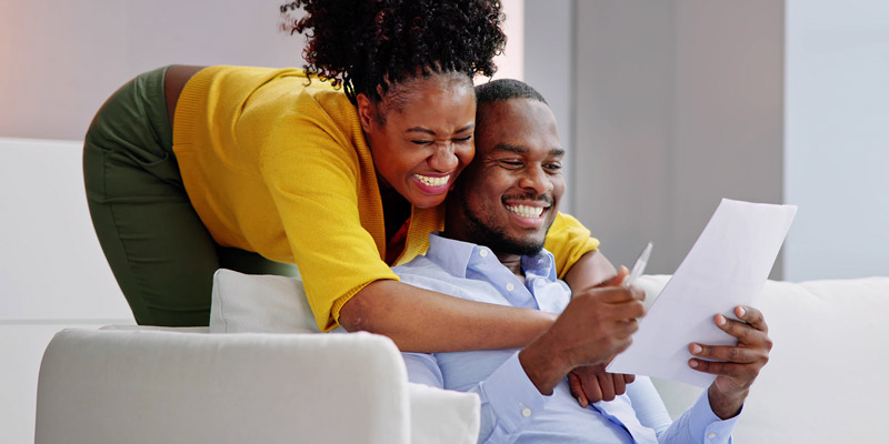 happy couple looking over paperwork