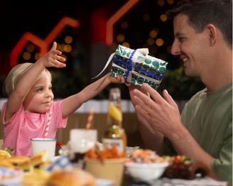 Family sharing dinner together at Big Top Shopping Centre