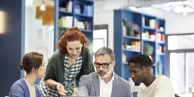 Multi-ethnic coworkers planning strategy in office