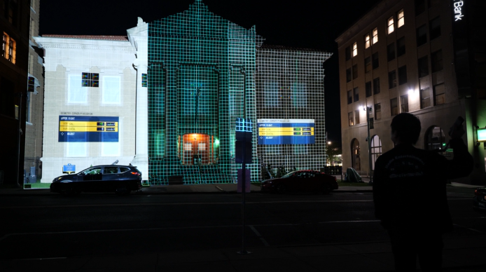 A grid on a building helps get the surface ready for digital projection mapping at night.