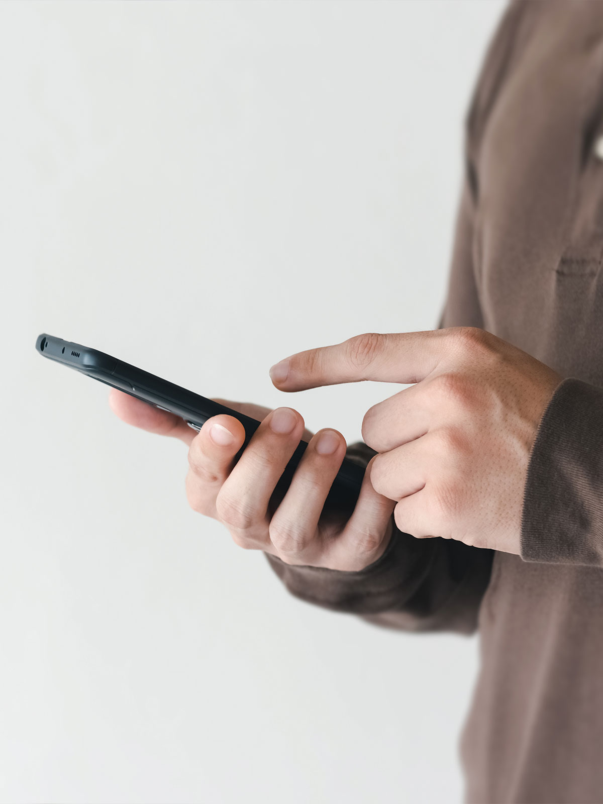 user texting on their cellular device