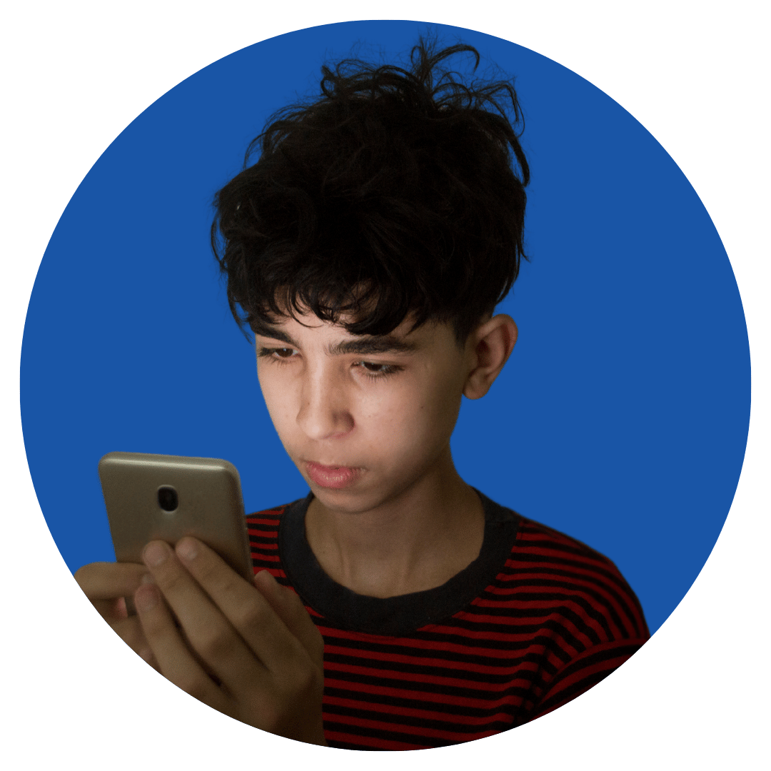 A person holding and looking at a mobile phone, shown inside a circular frame on a blue background.