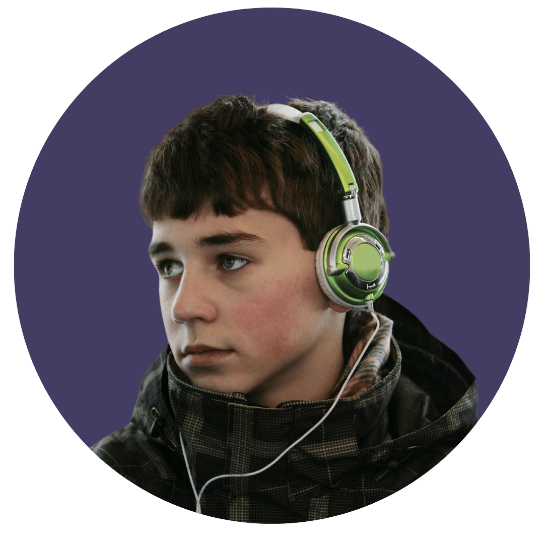A young male teenager with a gaming headset on inside a circular frame.