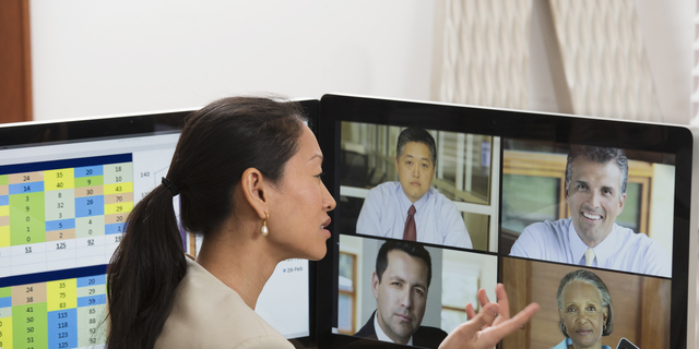 Businesswoman teleconferencing from home