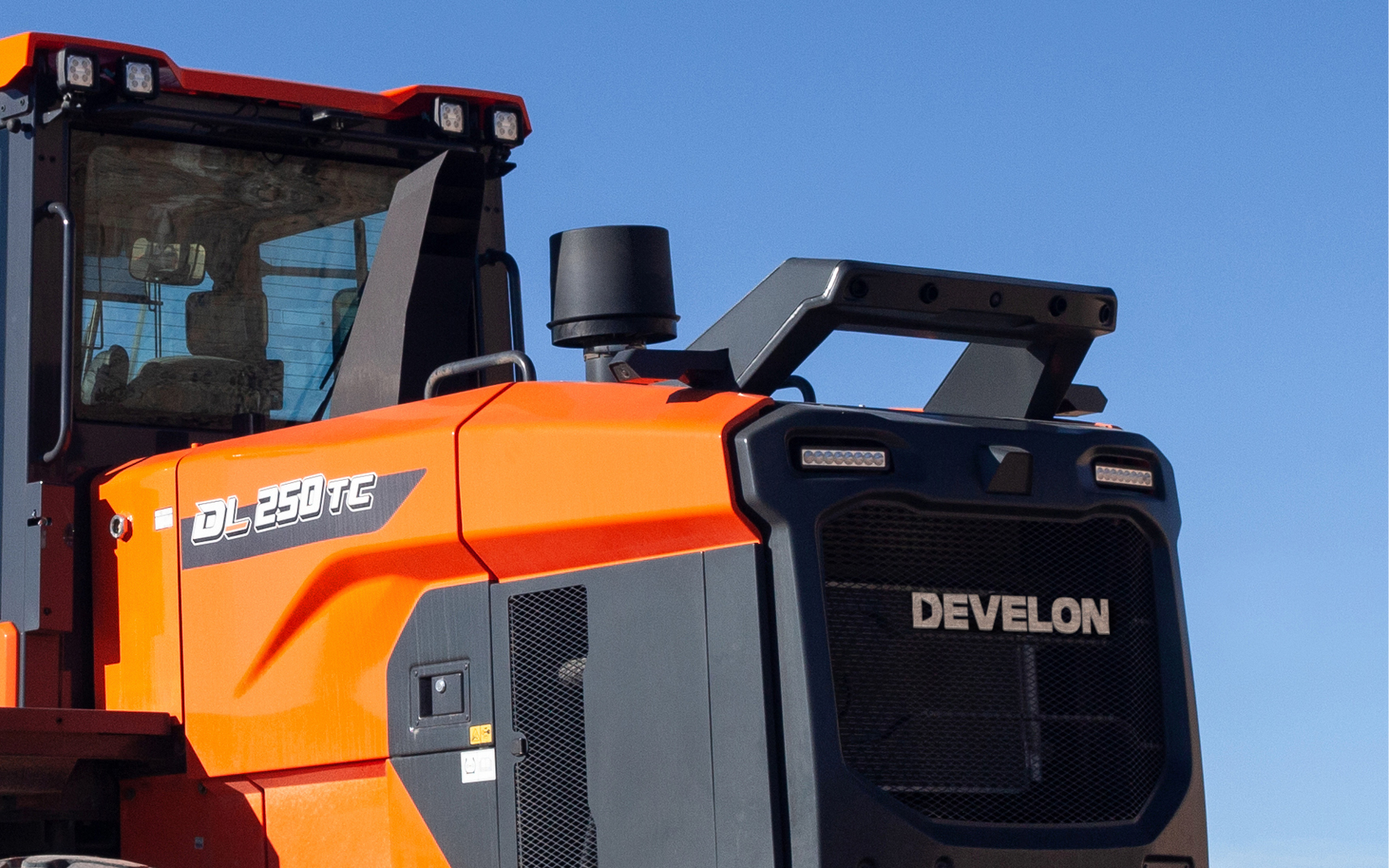 The DEVELON DL250TC-7 wheel loader has the optional object detection system installed on it.