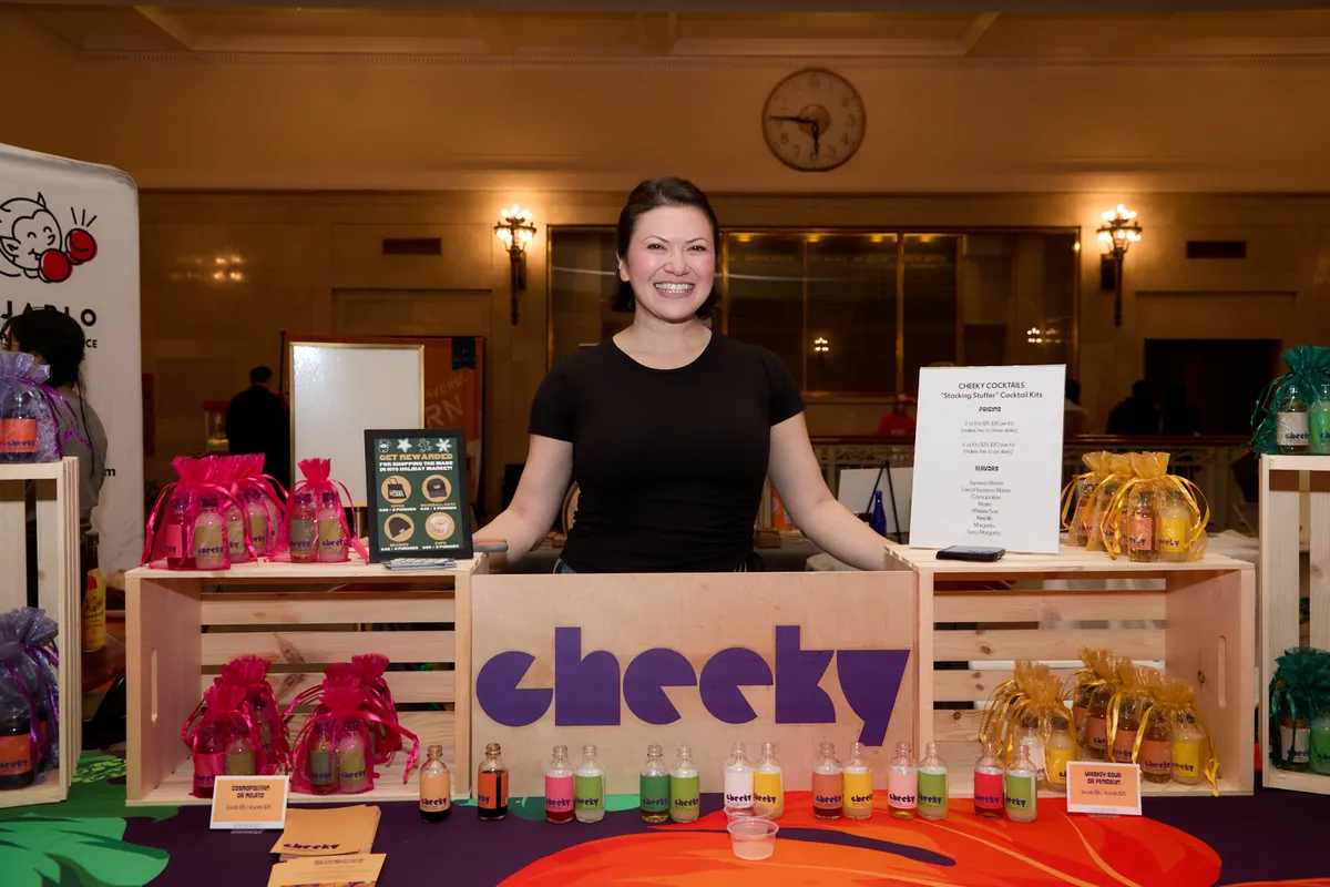 Setting up at a pop-up market - Cheeky booth.webp