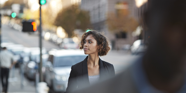 Businesspeople walking in pedestrian crossing