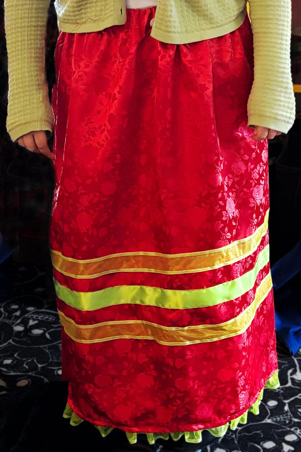Photograph of a model wearing a traditional Navajo skirt designed by Puls.