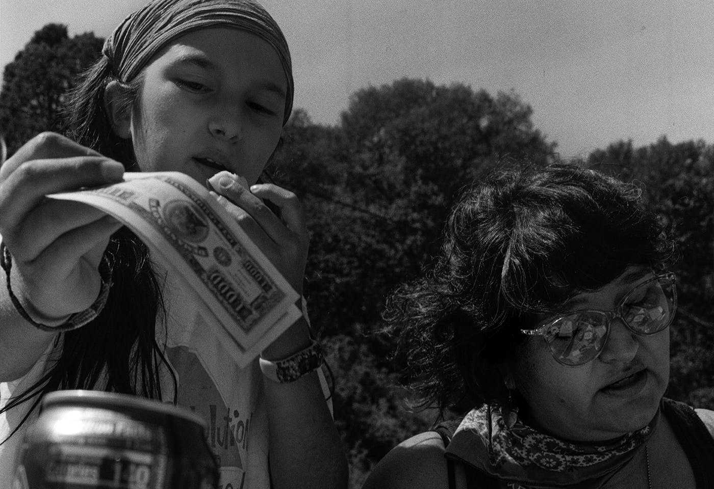 Black-and-white photograph of a young person and adult, captured by Parker Grace Puls