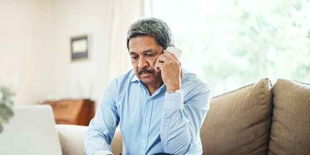 Hispanic man on phone.jpg