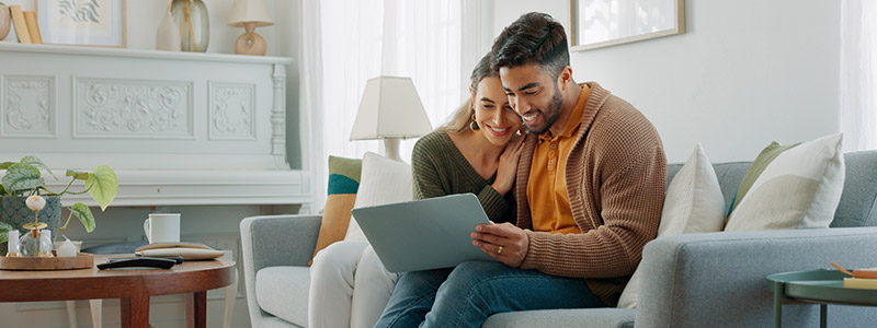 happy couple on laptop