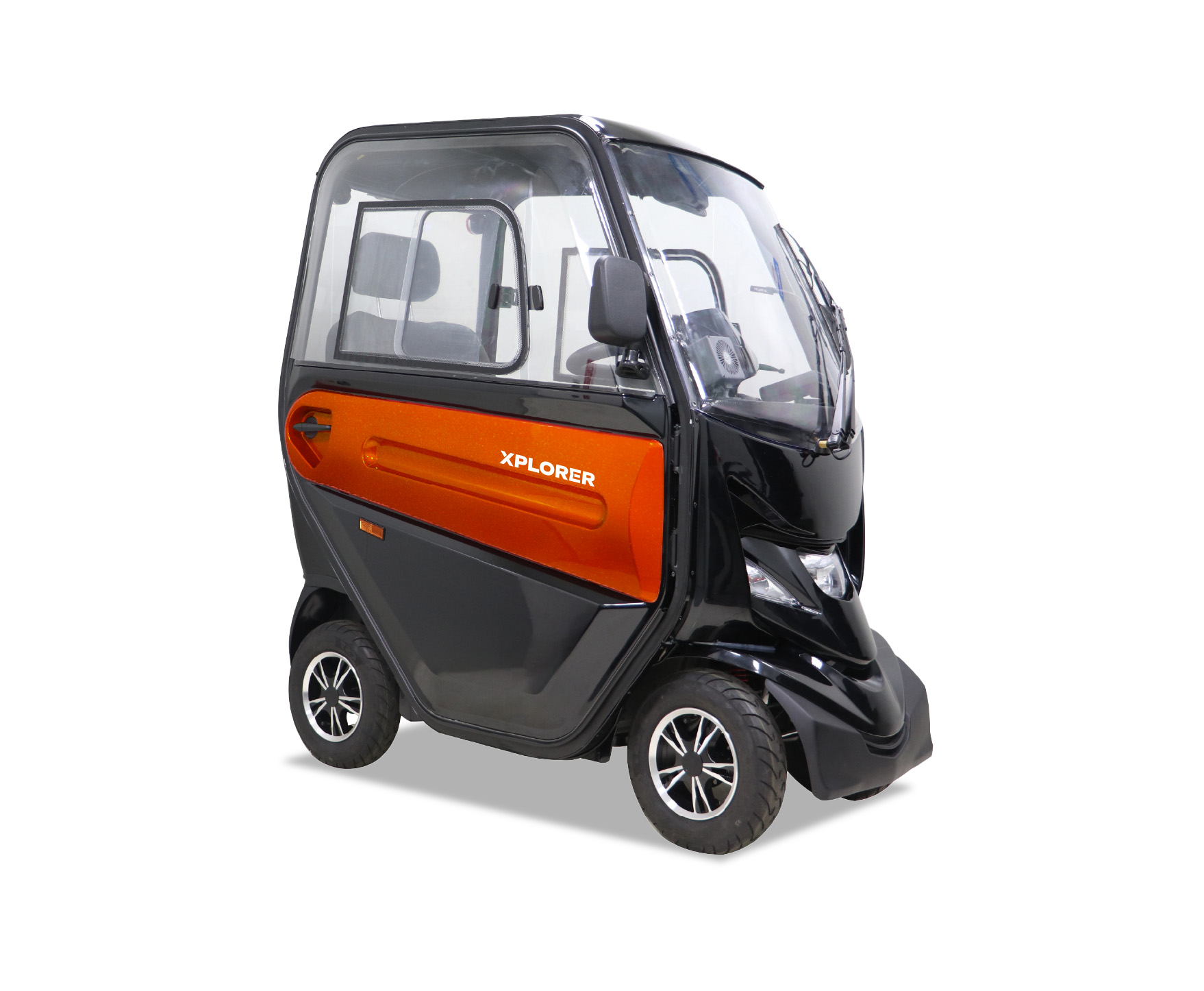 An enclosed mobility scooter named “Xplorer” with a black and orange shell, car-style doors, windscreen wipers, and full seating inside, designed for weather-protected travel.