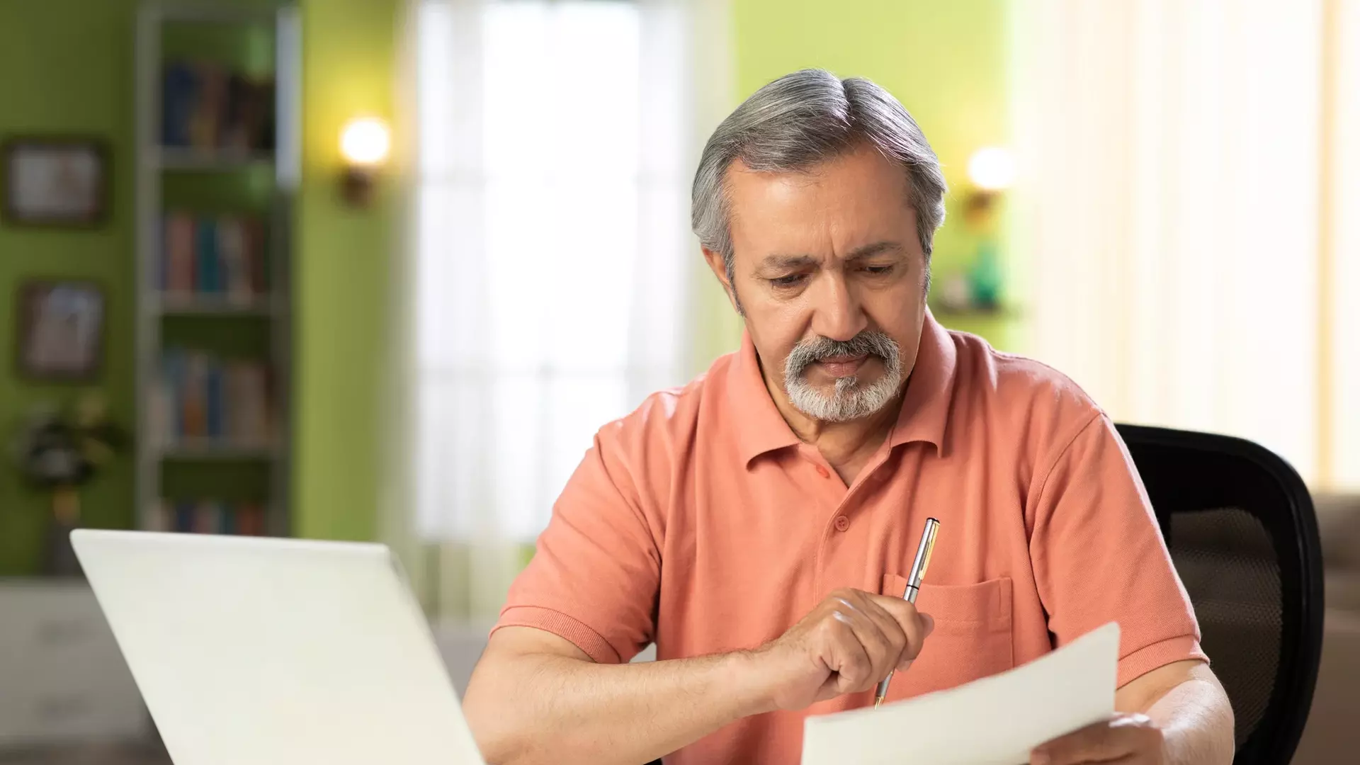 Man reviewing papers.webp