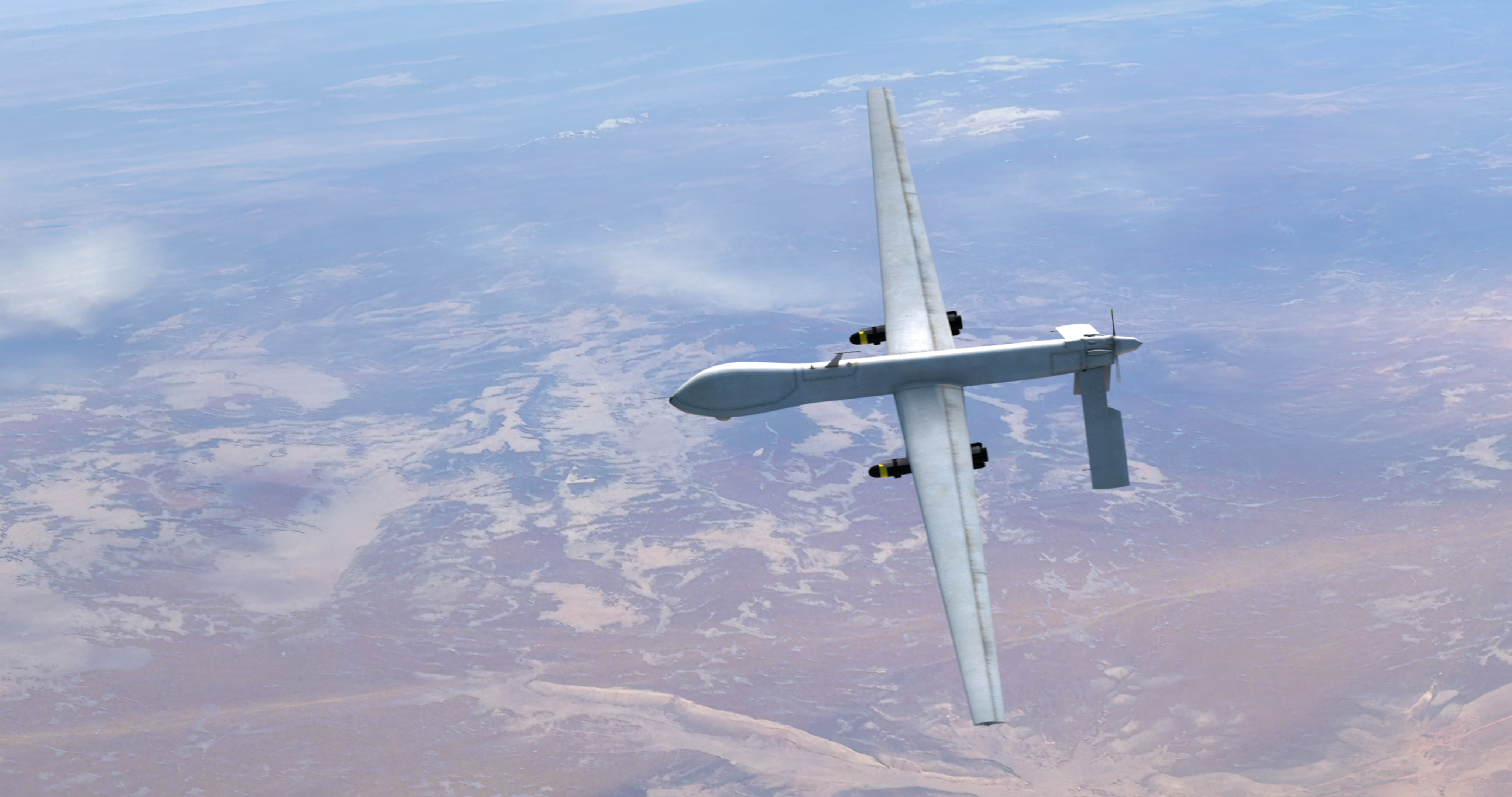 Flying defense technology over a desert landscape.
