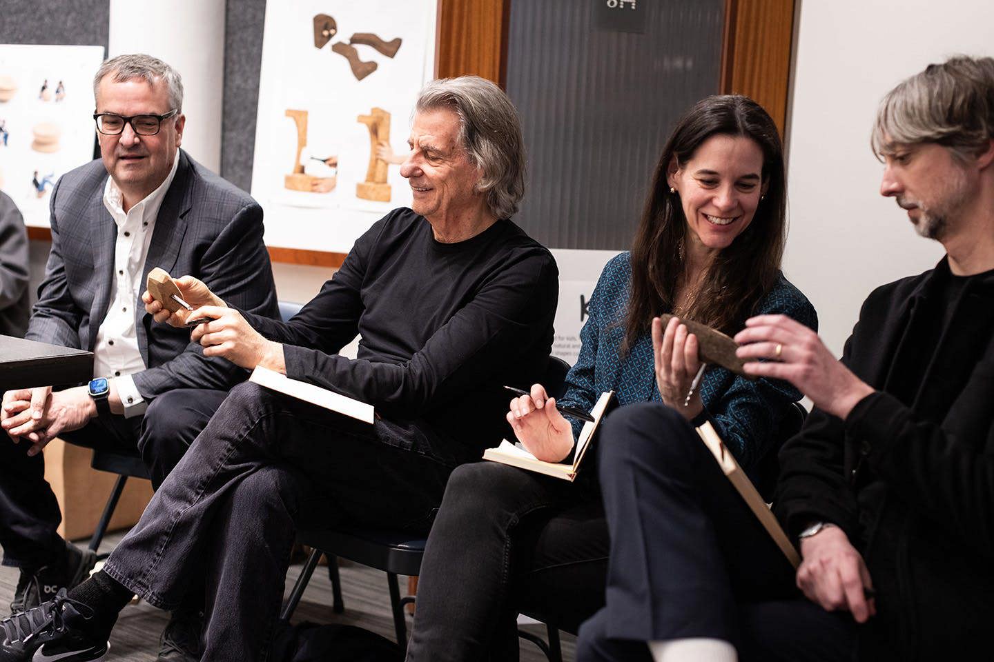 Seated from left to right, photograph of final competition judges including John McPhee, CEO of Chilewich; David Rockwell, founder of Rockwell Group who is shown holding a maquette of Aidan Murphy’s project; Annie Block, executive editor of Interior Design magazine; and Noah Schwarz, vice president of Product Design at MillerKnoll.