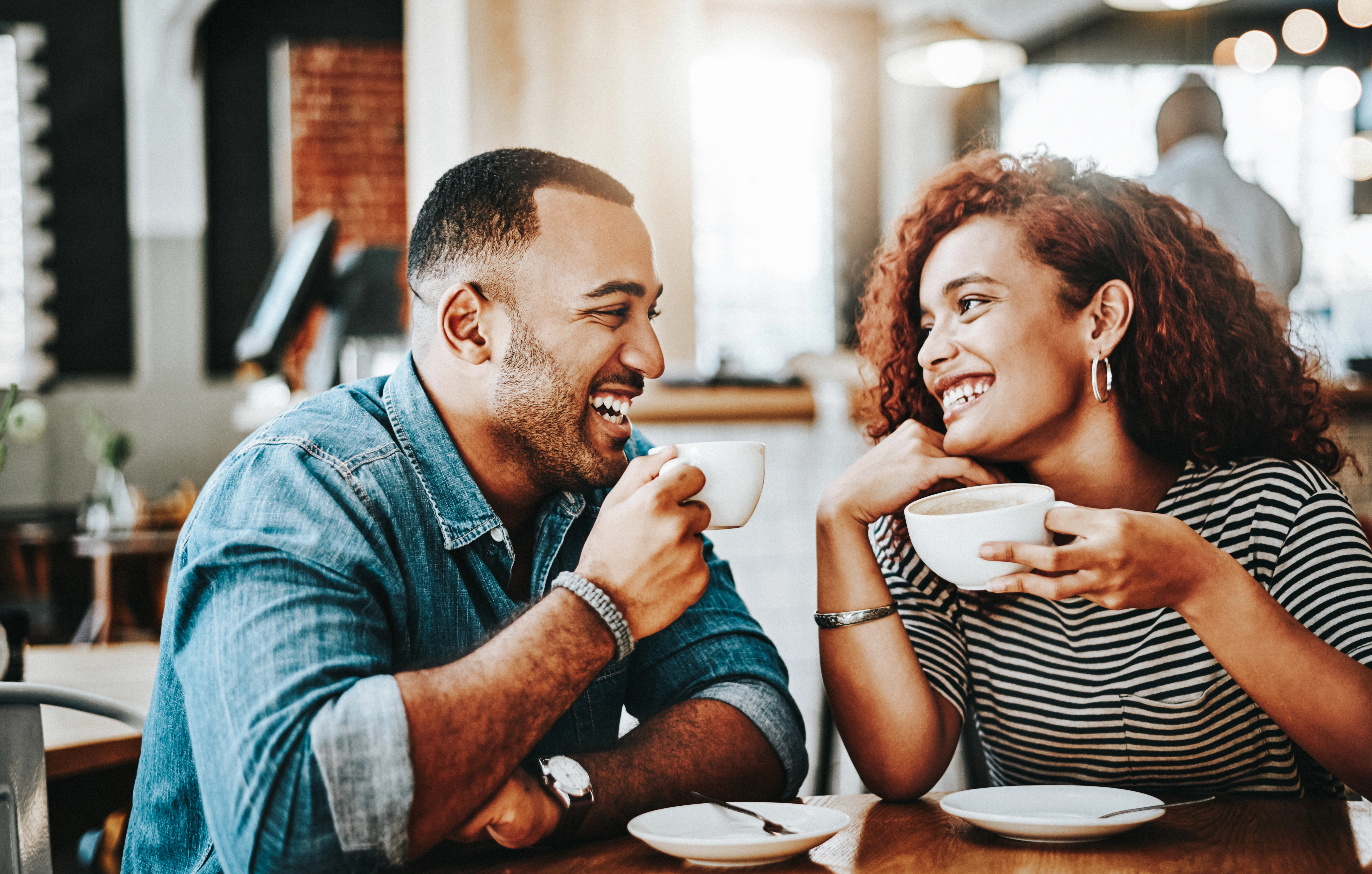 Young couple enjoying their date in the coffee shop 
