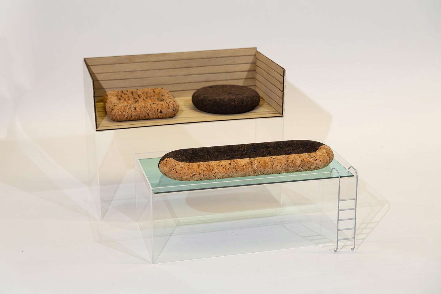 Display photograph of a model of Veronica Speyer’s cork patio and pool furniture suite, designed to float on water and resist mold