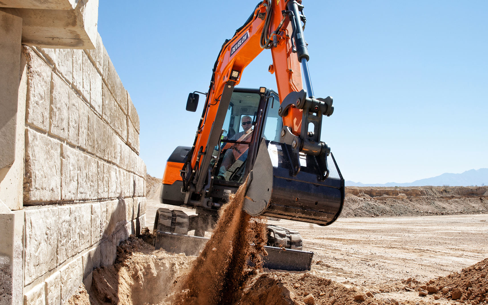 DEVELON  dealer provides service on the jobsite.