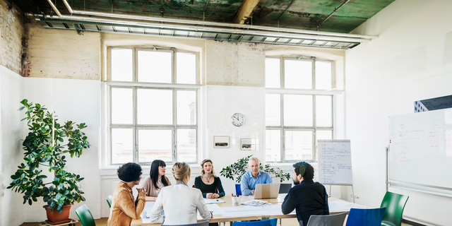 Office Team Having Meeting In Conference Room