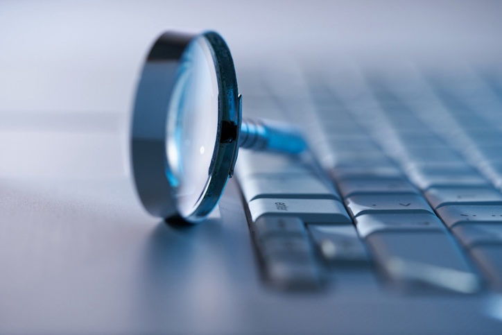 Magnifying glass on a keyboard