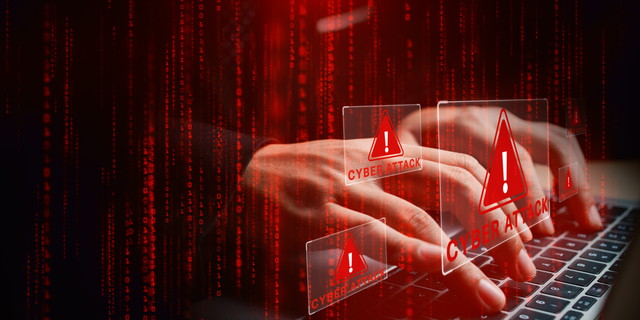 Laptop with hands typing amid glowing cyber attack alerts and red binary code, symbolizing hacking, data breach, and cybersecurity threats, 3d Rendering