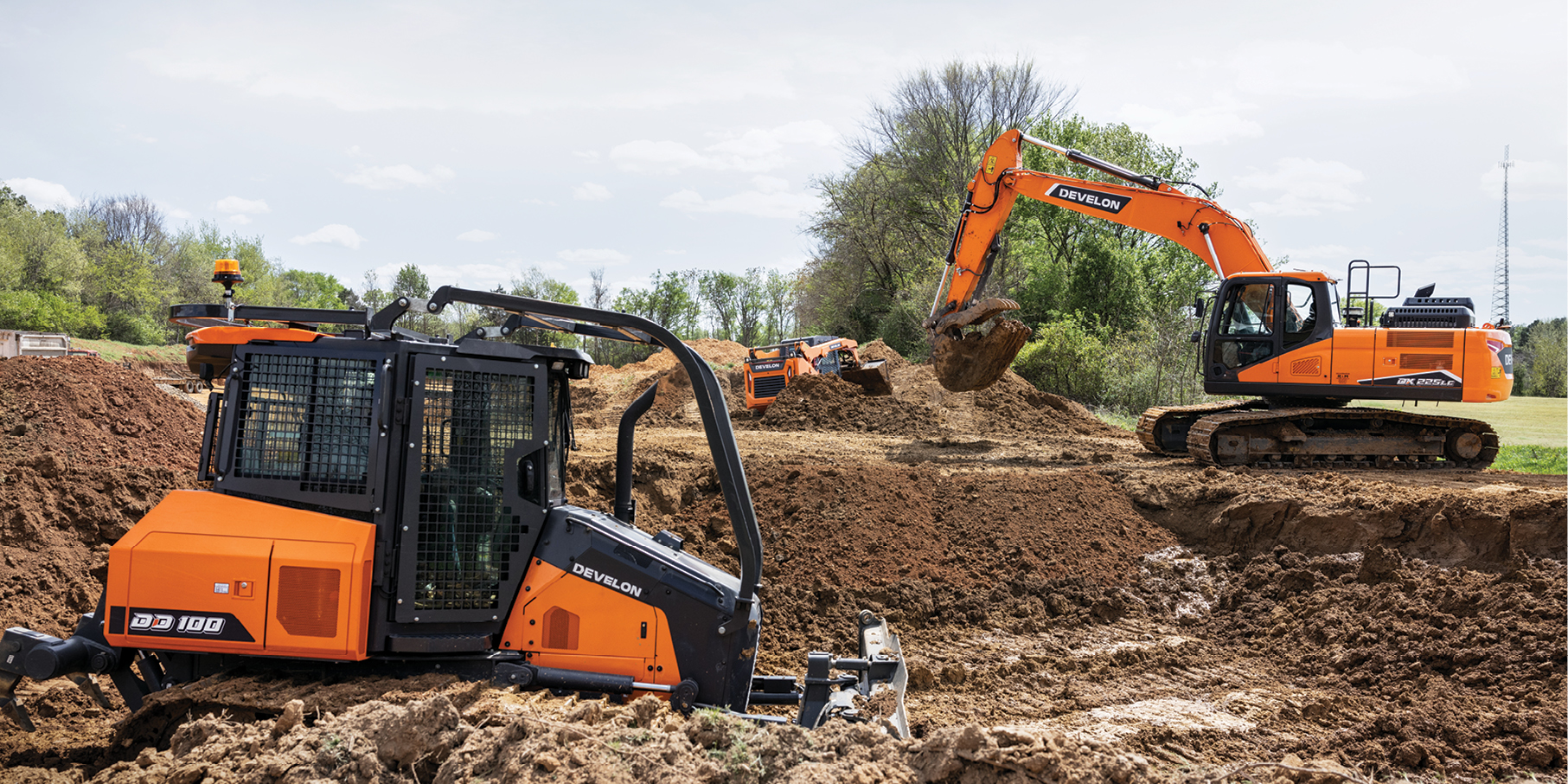 DEVELON dozer and crawler excavator working on a job site.