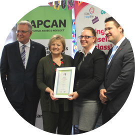 Kids Helpline staff accept an award.