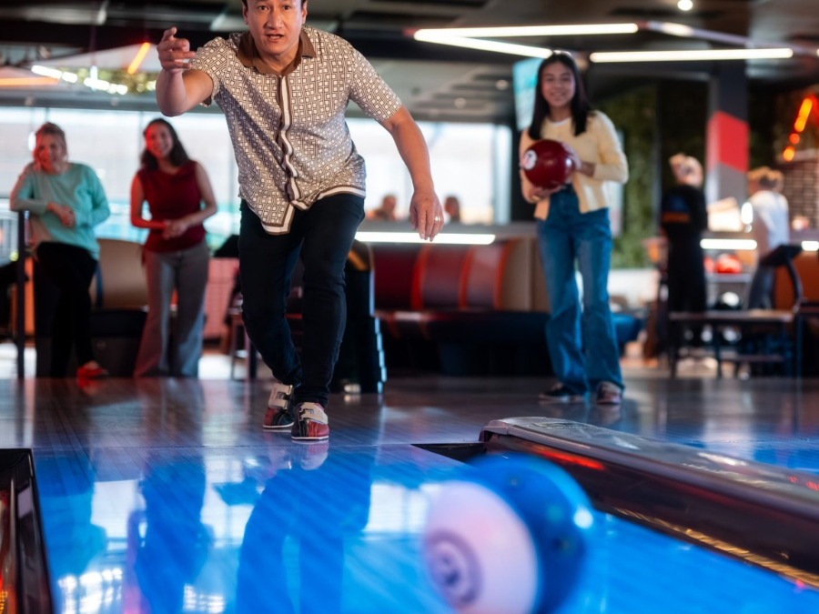 Family enjoying bowling and arcade games at Big Top Shopping Centre