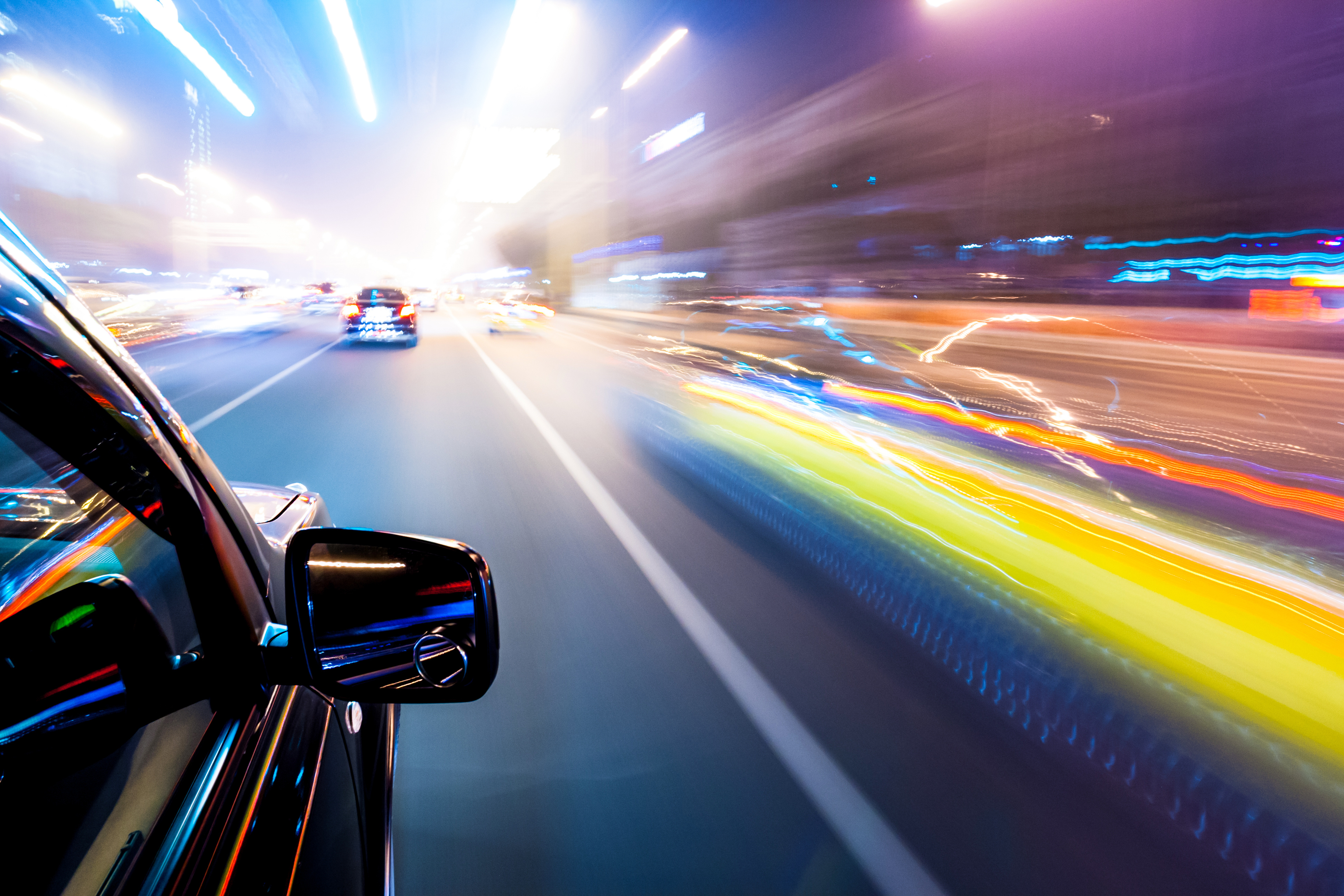 Car in a Tunnel at night with lights on includes various Materion materials