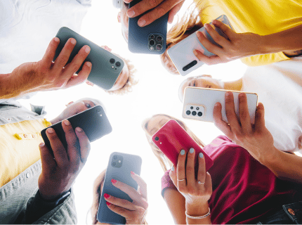 Teens holding smart phones