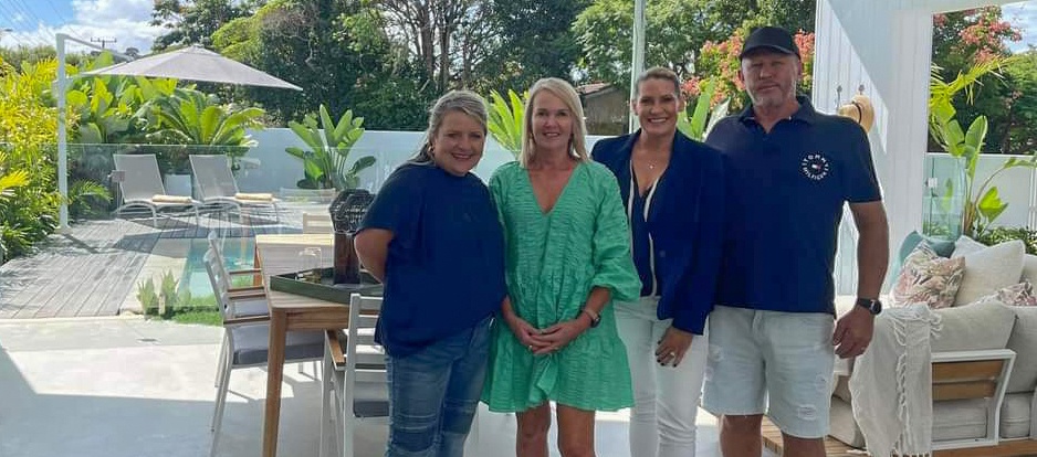 Prize Home Draw 515 winners with Jo and Tracey, with home in the background
