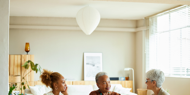 Financial advisor discussing with women at home