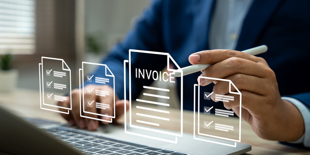 E-Invoice and Digital billing concept, Businessman using laptop to manage electronic statements on virtual screen. E-tax, Digital receipt, Online invoice processing and tax accounting solutions.