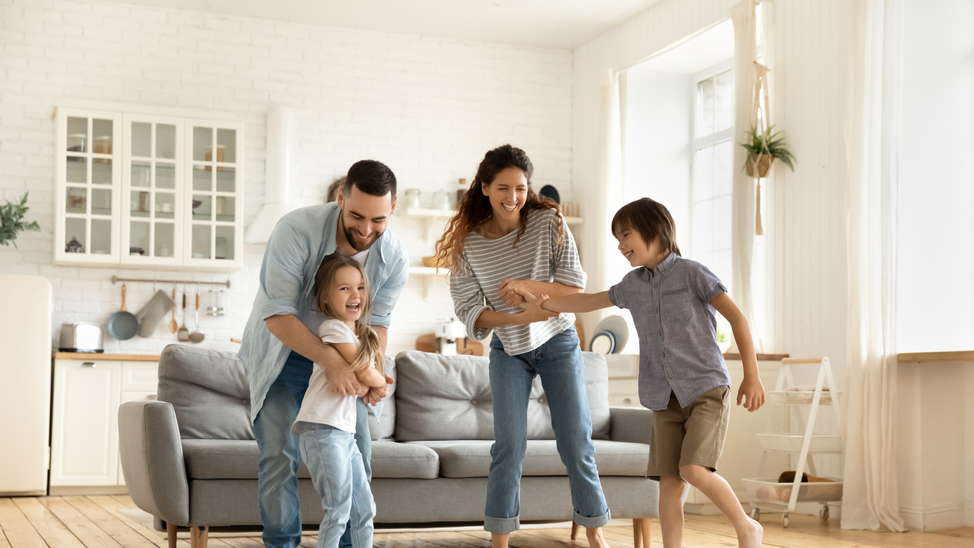 Happy family playing funny game having fun together.