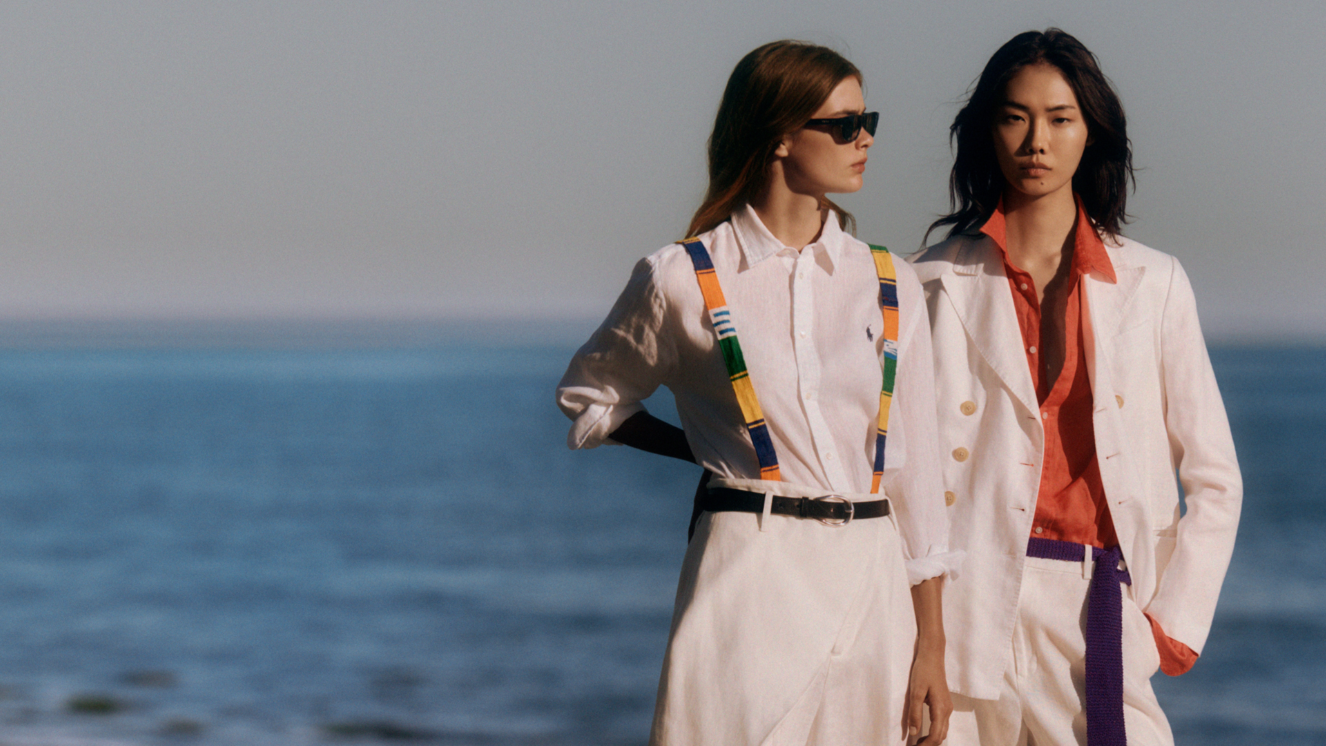 Polo Ralph Lauren fashion campaign featuring two models wearing refined coastal-inspired outfits by the ocean