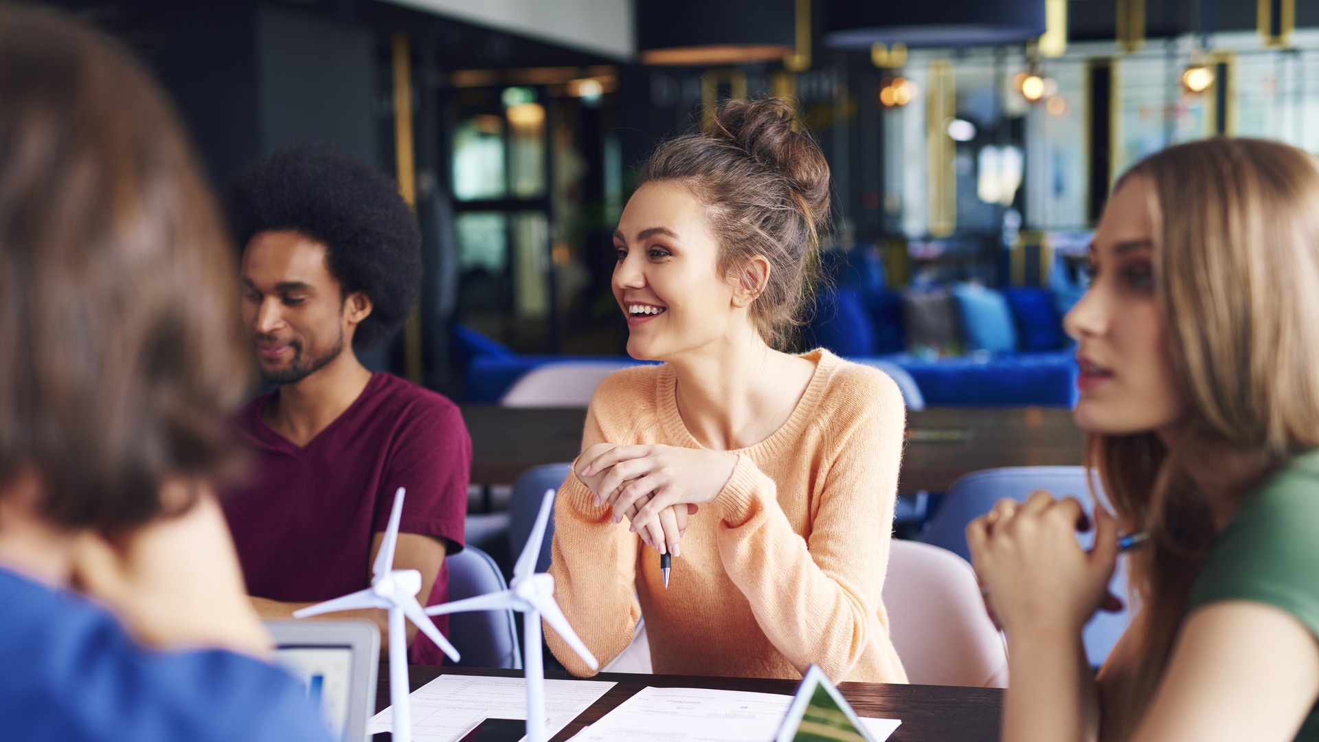 Young coworkers talking at conference table