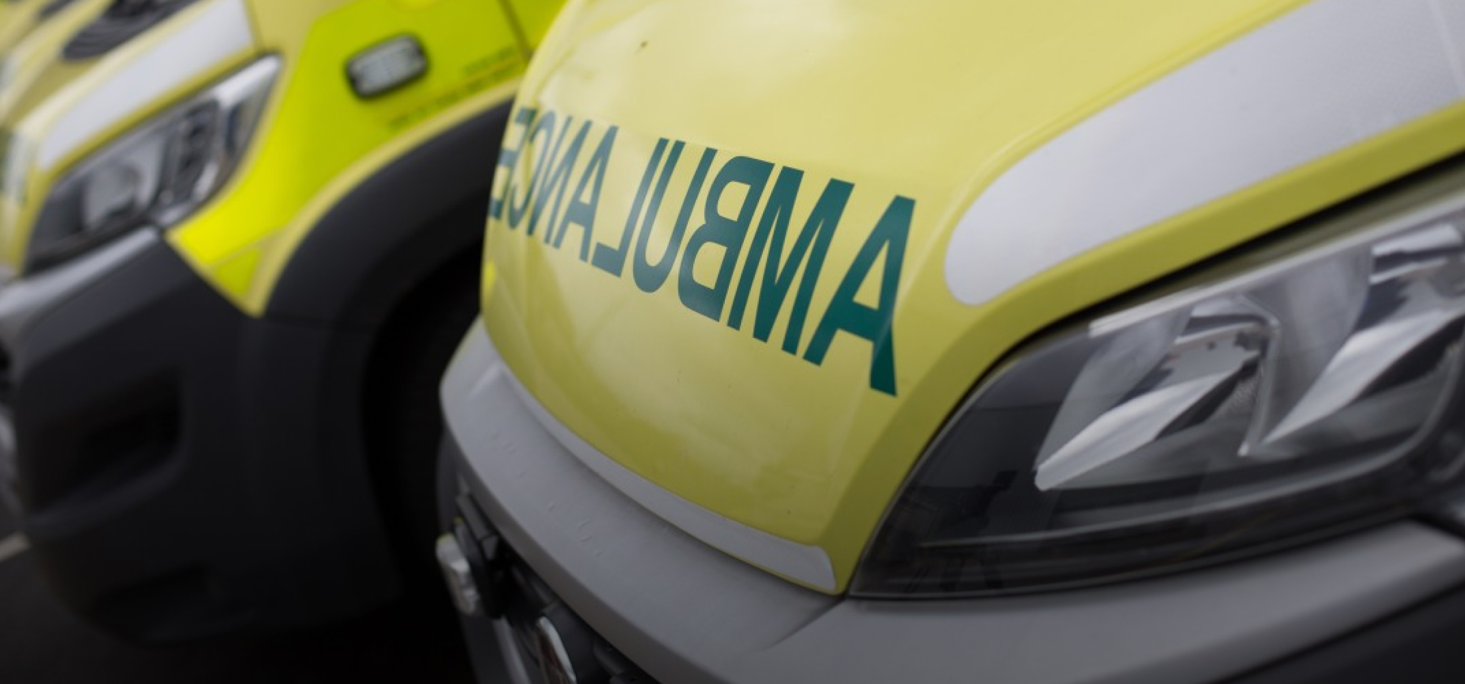 Two ambulances parked next to each other