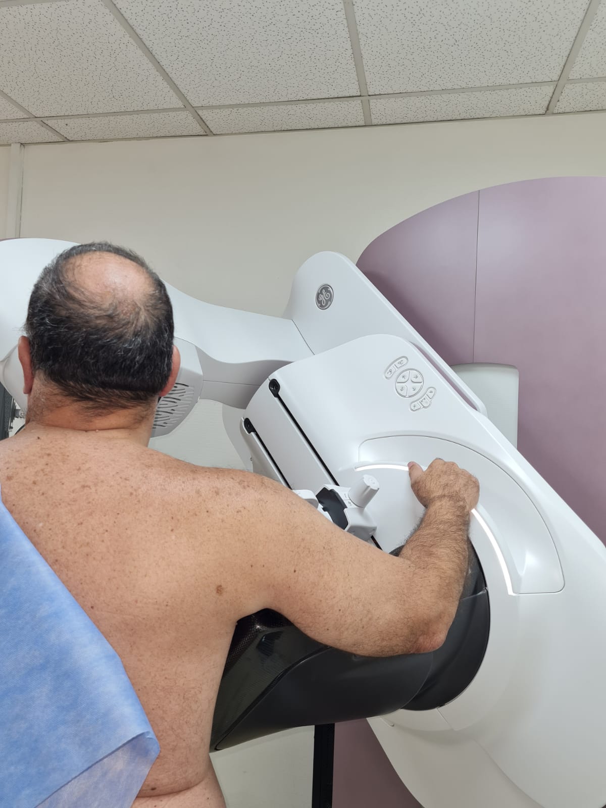 male patient having a mammography exam for breast cancer screening