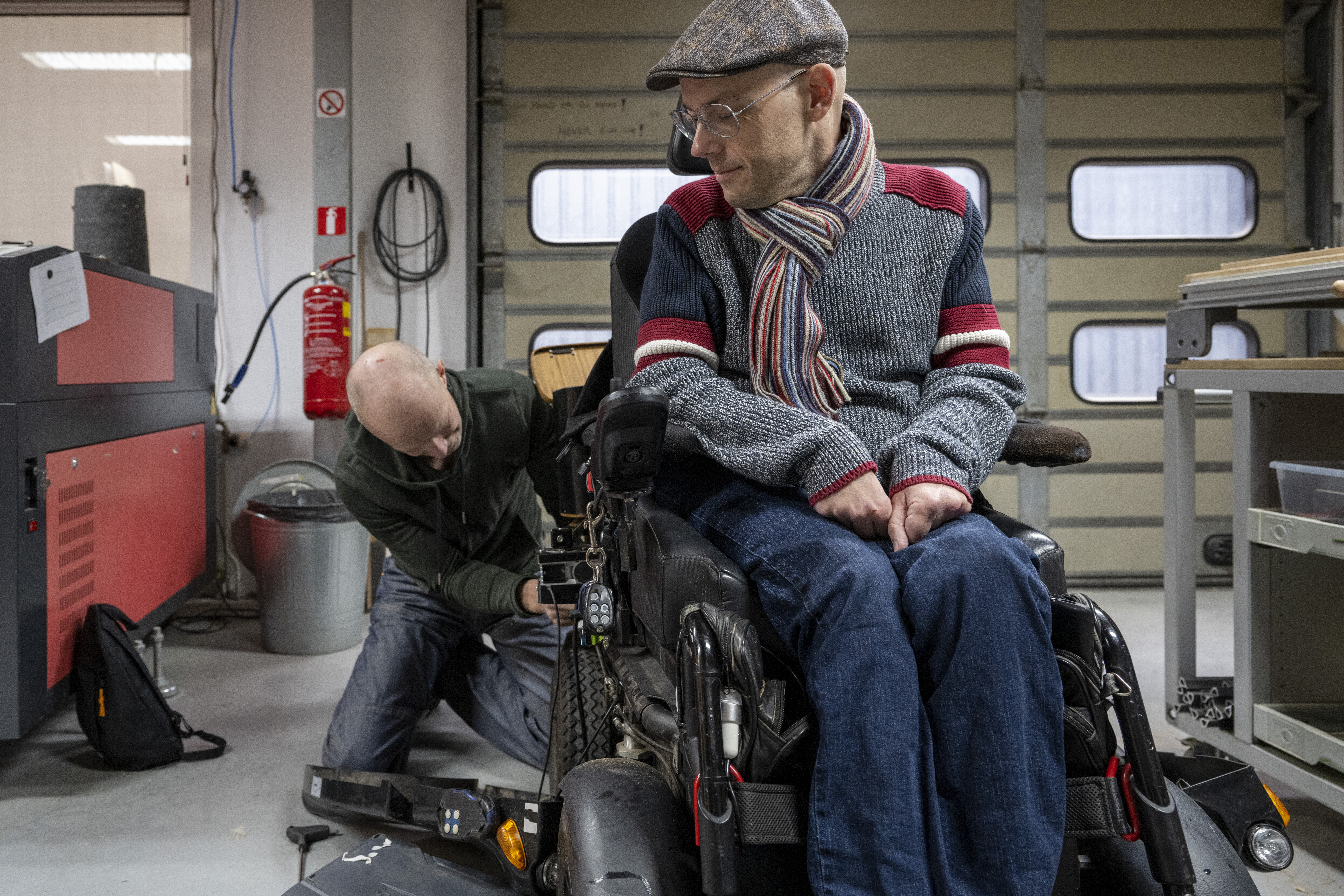 mechanic-servicing-powered-wheelchair