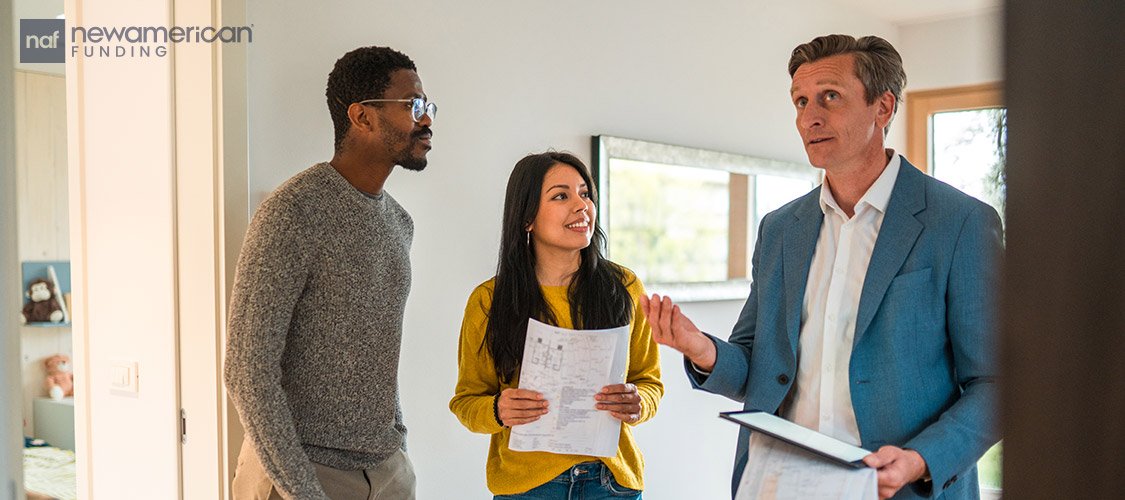 homebuyers listening to their real estate agent giving details of the home